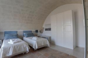 A bed or beds in a room at LAMIA MATERA 11