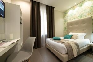 Postel nebo postele na pokoji v ubytování Hotel H21