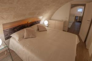 A bed or beds in a room at LAMIA MATERA 11