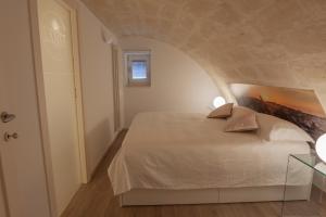 A bed or beds in a room at LAMIA MATERA 11