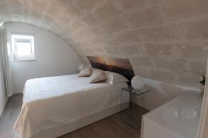 A bed or beds in a room at LAMIA MATERA 11