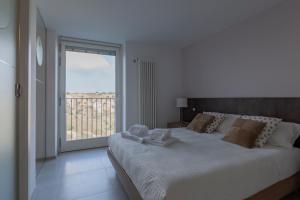 A bed or beds in a room at LAMIA MATERA 11