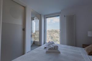 A bed or beds in a room at LAMIA MATERA 11