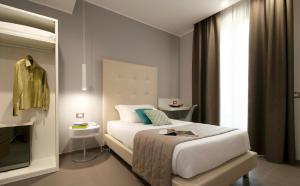 Postel nebo postele na pokoji v ubytování Hotel H21