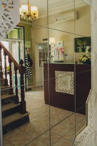 a store with a glass display case in a hallway at Hotel Império do Rei in Castelo Branco