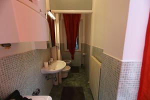 a bathroom with a sink and a toilet at La Persiana in Ancona