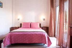 Ένα ή περισσότερα κρεβάτια σε δωμάτιο στο Stratos Hotel 