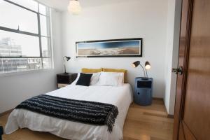 Ένα ή περισσότερα κρεβάτια σε δωμάτιο στο Dúplex/terraza privada en corazón Centro Histórico