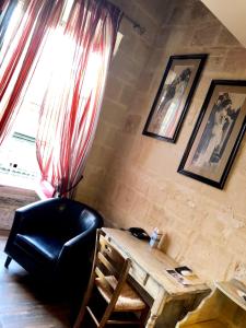 a room with a desk and a chair and a window at Luciano Valletta Boutique in Valletta