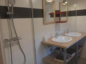 a bathroom with two sinks and a shower at Gite Manttu in Urrugne +6 photos