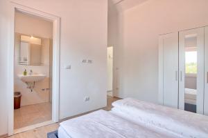 Postel nebo postele na pokoji v ubytování Villa Blaise