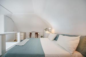 Posteľ alebo postele v izbe v ubytovaní Corricella Sea Window - Gioia Apartments