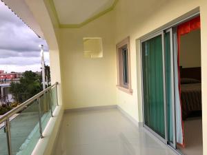 a balcony with a view of a bedroom at Hotel Yonu in Punta Cana