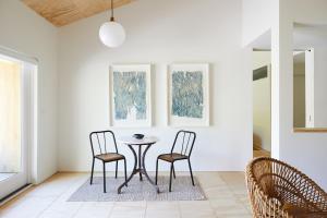 a dining room with two chairs and a table at Tourists in North Adams