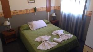 Ένα ή περισσότερα κρεβάτια σε δωμάτιο στο Hosteria Los Amigos