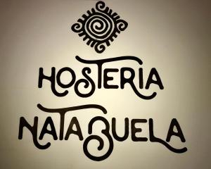 un panneau indiquant neeloreia naja sulula dans l'établissement Hotel y Hosteria Natabuela, à Natabuela