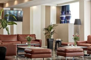 TV a/nebo společenská místnost v ubytování Candia Hotel