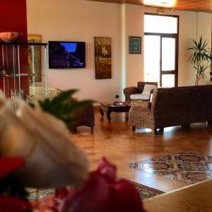 TV a/nebo společenská místnost v ubytování Residence Hotel Antica Perla