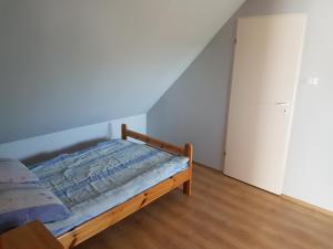 Posteľ alebo postele v izbe v ubytovaní Dom gościnny Krasne