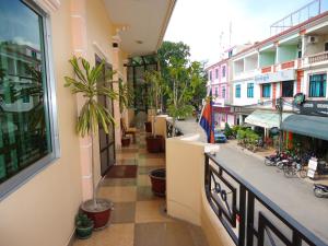 a view of a city street from a balcony at U-Dara Inn Guesthouse in Siem Reap