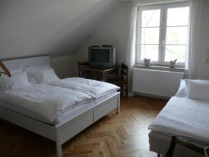 Tempat tidur dalam kamar di Penzion Venkoff