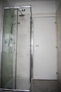 a shower with a glass door in a bathroom at Valsugana in Mestre