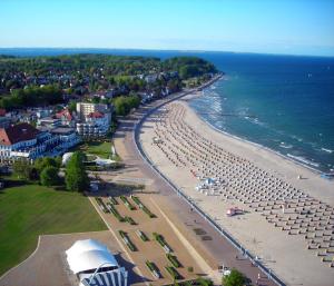 an aerial view of a beach with chairs and umbrellas at Finke in Travemünde