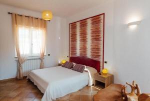 A bed or beds in a room at Vista Mare B&B