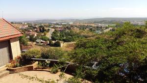 a view of a town from a house at Arek's Place in Krugersdorp