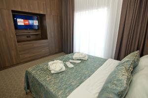 Postel nebo postele na pokoji v ubytování Sky Inn Batumi