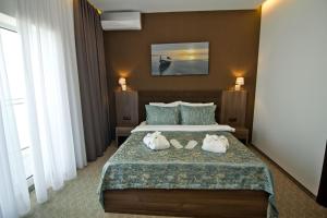 Postel nebo postele na pokoji v ubytování Sky Inn Batumi