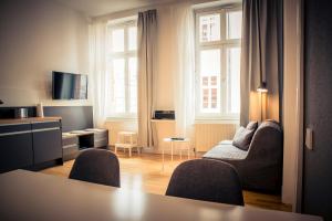 TV a/nebo společenská místnost v ubytování Schwerin City Apartment