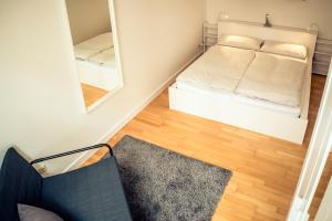 Postel nebo postele na pokoji v ubytování Schwerin City Apartment