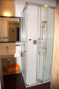Koupelna v ubytování Pension Appartements Reithof + 36 fotografií