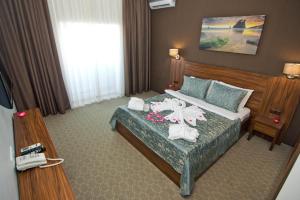 Postel nebo postele na pokoji v ubytování Sky Inn Batumi