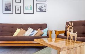 a living room with a couch and a coffee table at DayFlat Apartments Olimpiyska Area in Kyiv