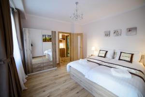 Posteľ alebo postele v izbe v ubytovaní Diana Apartments Karlovy Vary