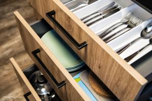 a drawer filled with utensils in a kitchen at Übernachten in der Tenne in Nuremberg