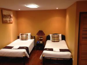 Säng eller sängar i ett rum på China Guest Inn