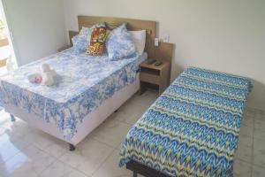 Voodi või voodid majutusasutuse Pousada Acuípe toas