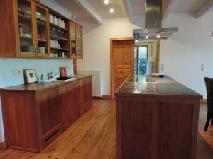 a kitchen with a large island in a room at Haus Katha Koserow in Ostseebad Koserow