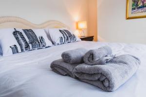 Ένα ή περισσότερα κρεβάτια σε δωμάτιο στο Atrium apartment B