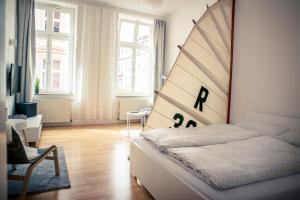Postel nebo postele na pokoji v ubytování Schwerin City Apartment