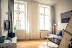 TV a/nebo společenská místnost v ubytování Schwerin City Apartment