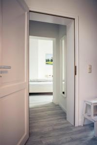 Postel nebo postele na pokoji v ubytování Schwerin City Apartment