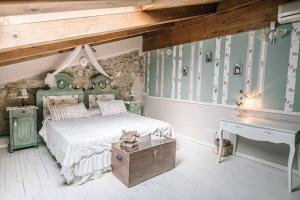 Postel nebo postele na pokoji v ubytování B&B - Relais de charme la Caminella