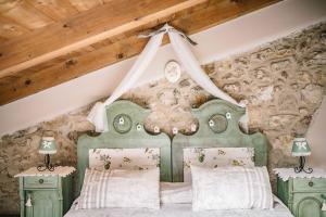 Postel nebo postele na pokoji v ubytování B&B - Relais de charme la Caminella