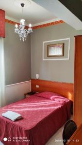 Кровать или кровати в номере Hotel Minerva