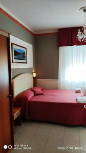 Кровать или кровати в номере Hotel Minerva