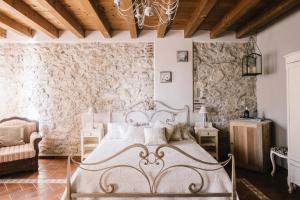 Postel nebo postele na pokoji v ubytování B&B - Relais de charme la Caminella